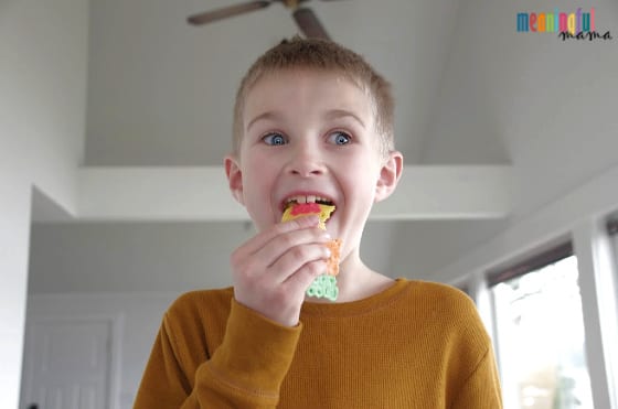 Boy eating Edible Perler Bead Art with Twizzlers
